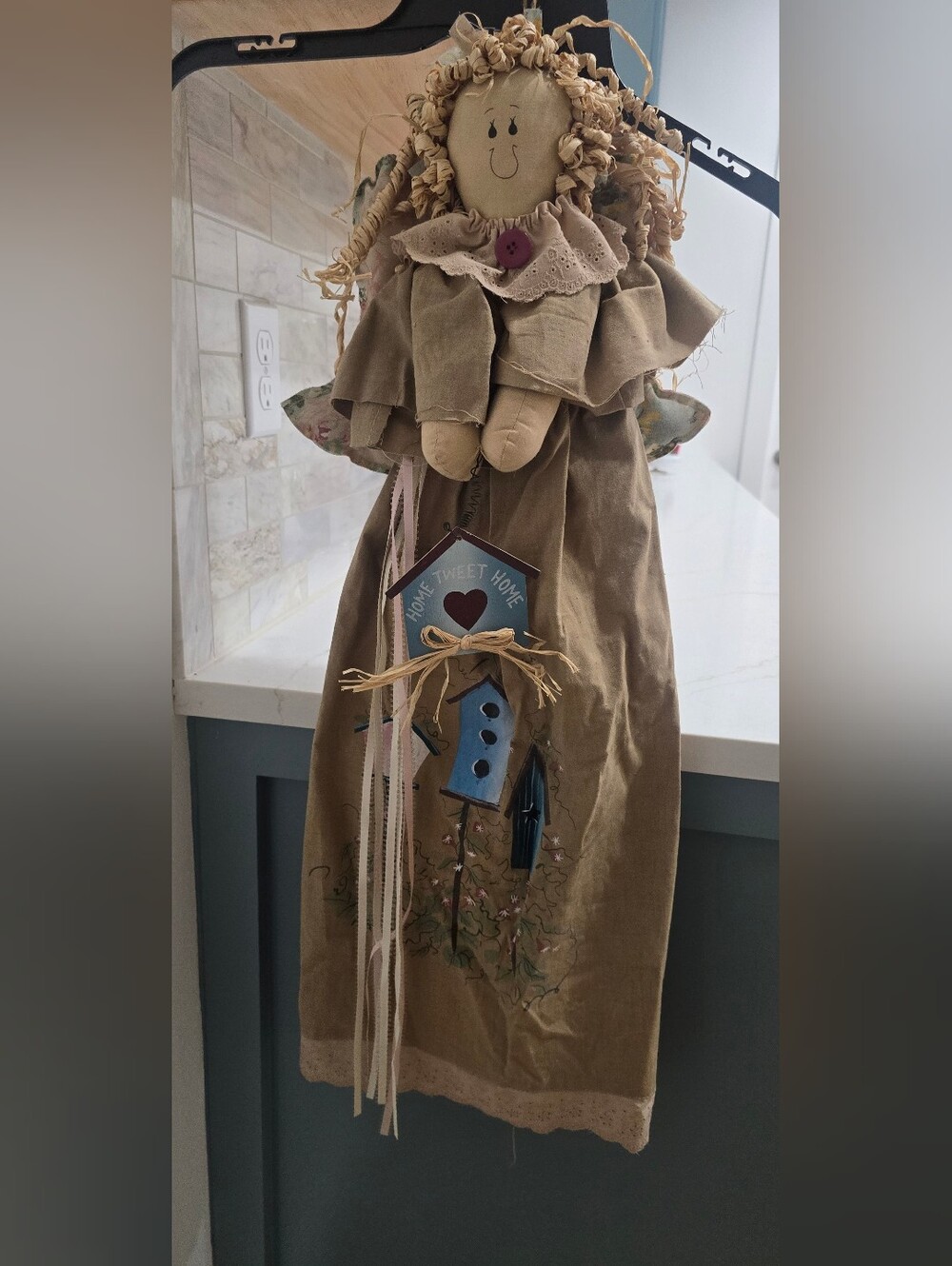 Sweet 30-inch hanging angel with curly raffia hair, floral wings, lace trim, and